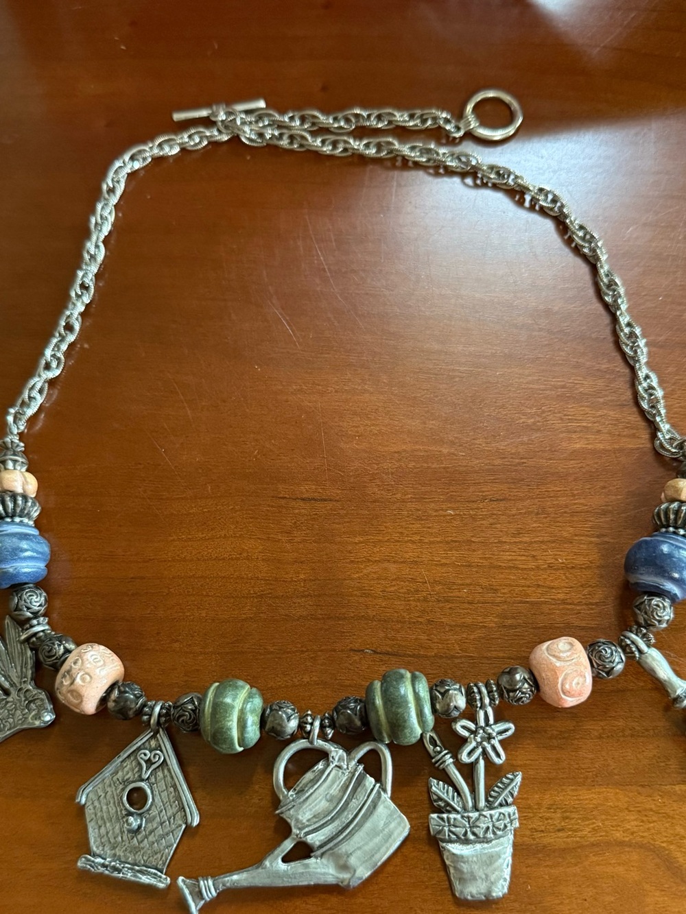 Silver-Tone 25” Garden Themed Charm Necklace with Blue, Beige, & Green Beads